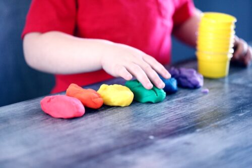 child playing with clay